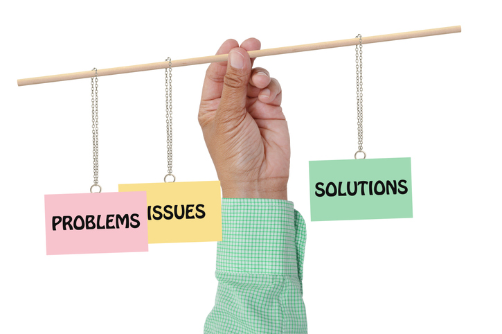 a hand holding a rod to balance problems, issues and solutions